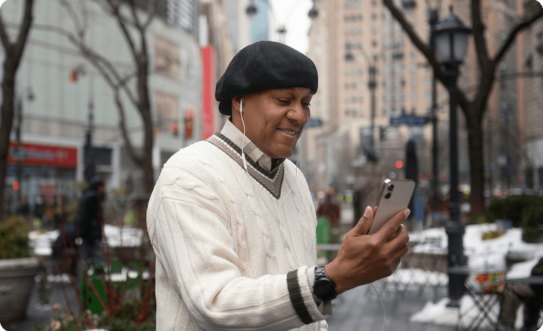 Man using smartphone outdoors
